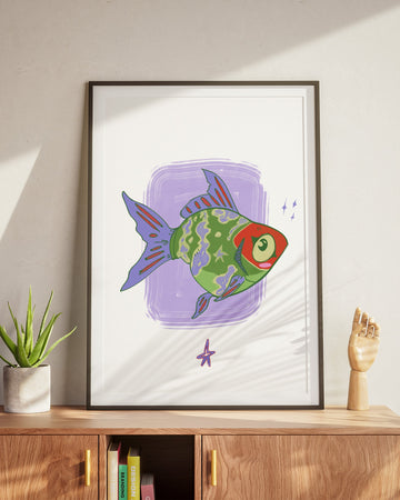 Framed artwork of a colorful fish on a wall above a wooden cabinet.