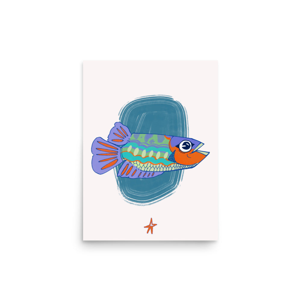Framed illustration of a colorful fish on a wall above a wooden cabinet.
