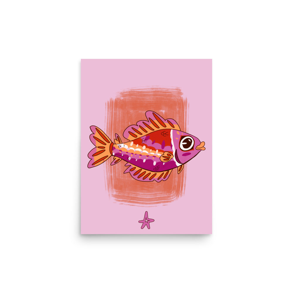 Framed artwork of a colorful fish on a pink background, displayed on a wooden cabinet.