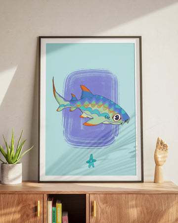 Framed artwork of a colorful fish on a wall above a wooden cabinet.