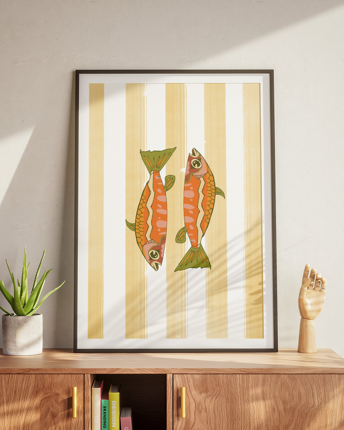 patterned fish poster design on a yellow striped background
